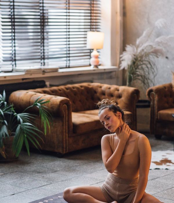 A person gently stretching, representing relaxation and finding balance.